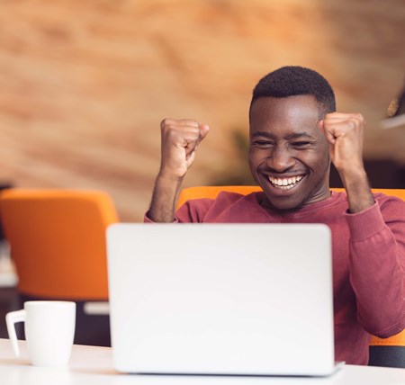 Person on a video call celebrating success