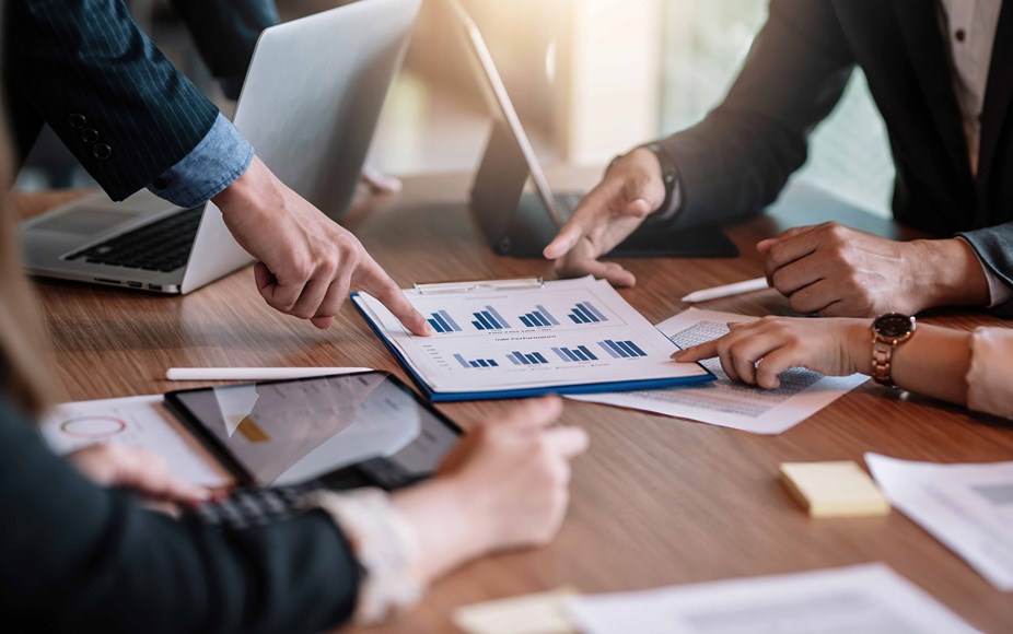 Group of people reviewing statistics